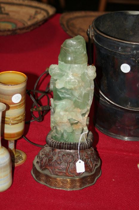 carved jade lighted jar with lid on rosewood stand