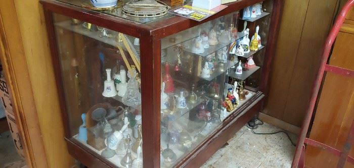 lovely old shop display cabinet filled with bells