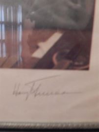 Harry Trumans signature on framed photo.