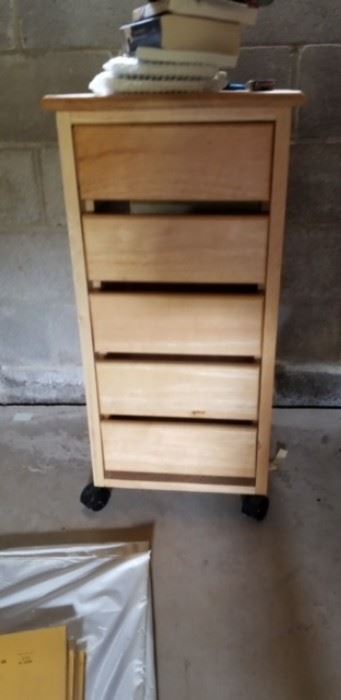 Very nice size storage cabinet with drawers on rollers.