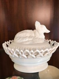 Early, covered milk glass with fox design.