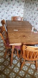 Oak dinette set - table and four chairs.