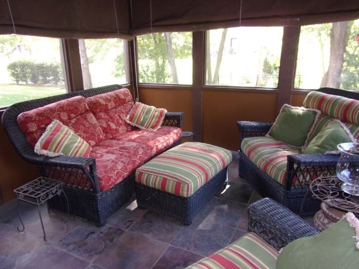 Blue real wicker patio set. Love seat and two armchairs with ottoman. In great condition!