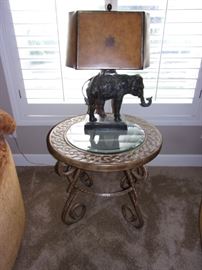 Beautiful vintage Maitland bronze elephant lamp. Iron base round table with glass center.