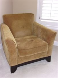 Home Wear gold colored armchair.