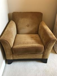 Home Wear gold colored armchair.