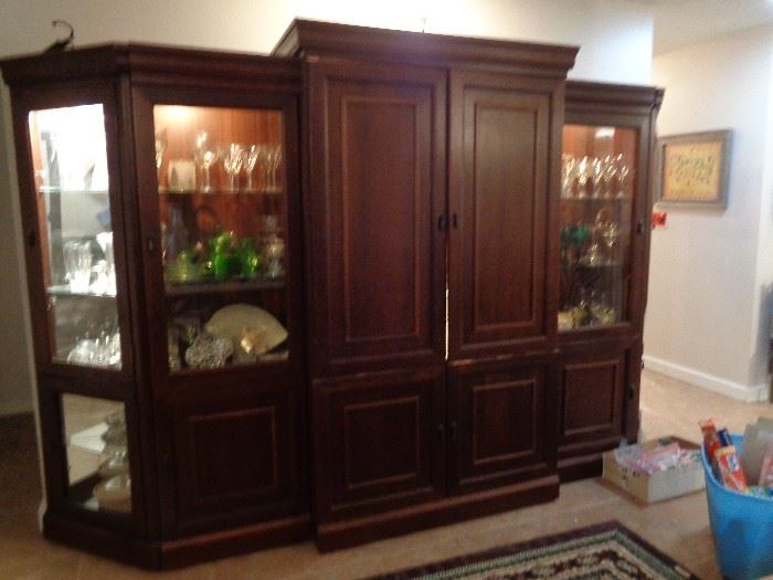 5 piece entertainment center, remove the center piece and have a great china hutch, all areas lighted. pretty nice