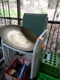 large metal round thing & 8 patio chairs