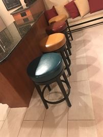Multi colored bar stools. 