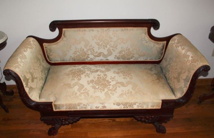 169 - SETTEE - Mid 1800's, Empire style, turned crest rail terminating in rosettes, scrolled arms with facings carved with acanthus leaves, paw feet, ivory damask upholstery.
