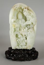 Chinese white jade boulder carving of Guanyin