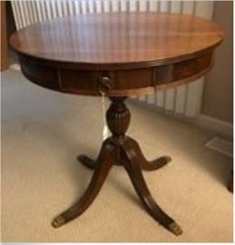 One of several antique tables available, of varying ages, sizes, manufacturers, materials, and prices; Item shows is a 1940s English Regency Style Mahogany Round Center Table with 4 Drawers, for $475