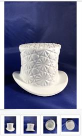 Many milk-glass items are available, of different sizes, designs, manufacturers, ages, and prices; The item shown is a Vintage Fenton Top Hat White Milk Glass Daisy and Button Design, which is perfect for Steampunk lovers, for $15