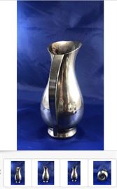 The Vintage K & M - Royal Holland Pewter 6” Pitcher / Ewer / Vase shown above is one of several pewter or silver items; This one is priced at $15, and the prices of the other items depend on the size, quality, manufacturer, age, condition, and material(s).