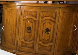 This gorgeous Mid-Century Liquor Cabinet is in great original condition, is one of two cabinets available, and listed at $540. We have another liquor cabinet of the same age available in a different design that is painted, and is listed at a discounted price of $385.