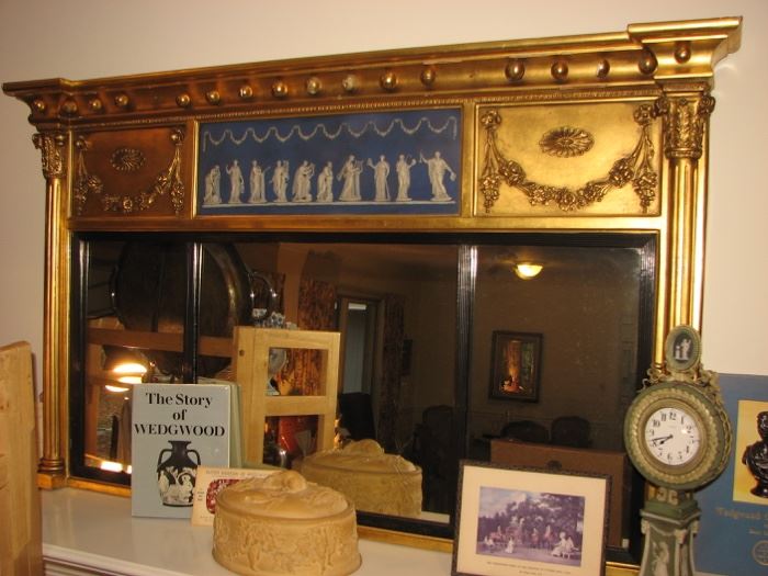 This is a monumental Federal gilted mirror with a Wedgwood Blue and White Jasperware plaque, possibly Philadelphia, c.1810-20.