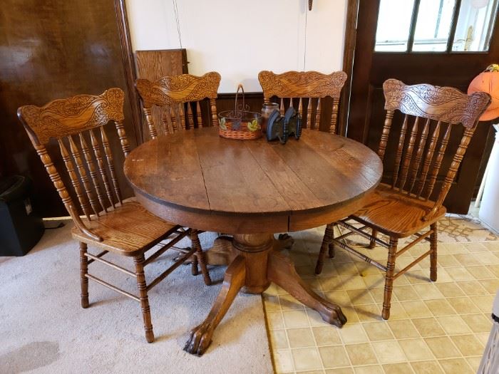 Antique round Oak table and reproduction chairs