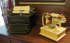 Antique typewriter, vintage style telephone