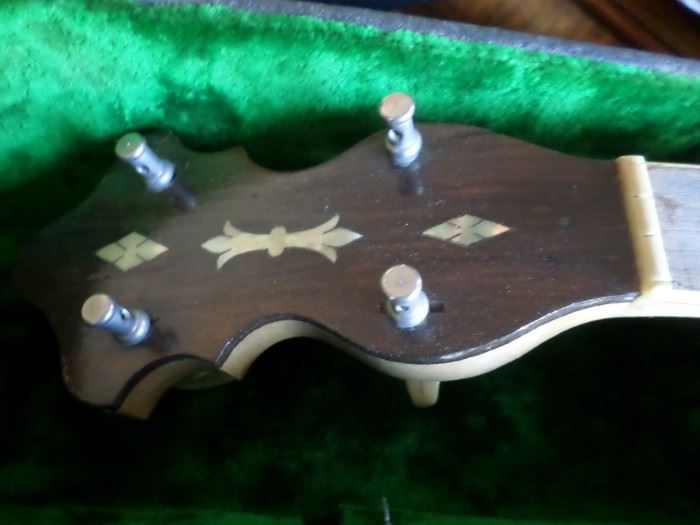 Vintage Gretsch 4 string banjo, in laid mother of pearl at top. Needs strings. In original case, Circa 1930