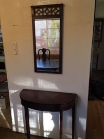 Framed mirror and demi-lune table