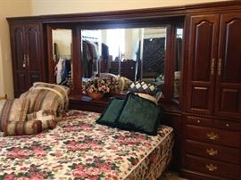 King bed with large mirrored "headboard" unit