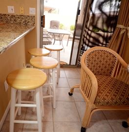 Countertop/bar stools for sale. Beyond the window is the patio set for sale. 