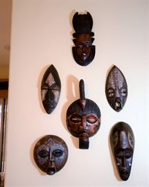 Wooden African masks for sale. Makes wonderful wall art all in a grouping.