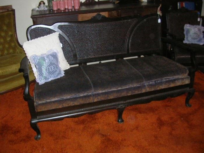 Turn of the century settee with wicker back
