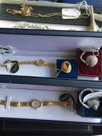 Gold watches, chains, and rings