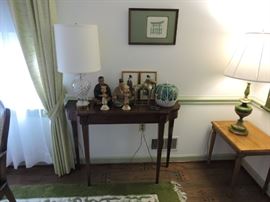 Sofa table with japanese art figurines and ginger jar