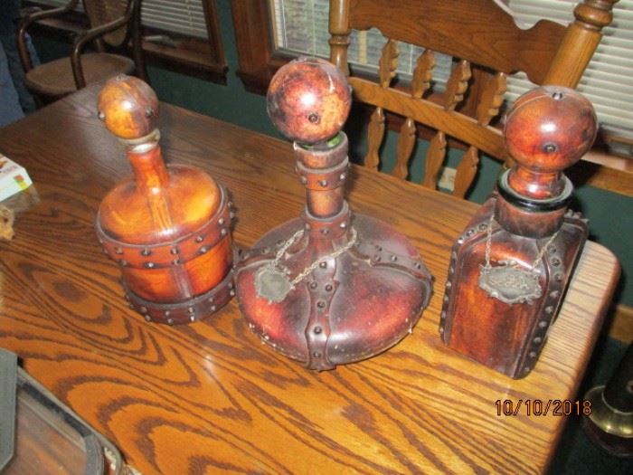 leather decanters on a nice oak table