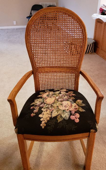 two arm chairs with needlepoint seats