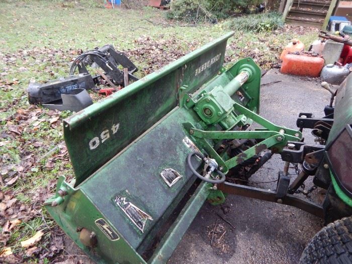 Tiller front to the John Deere tractor... comes with the complete package.