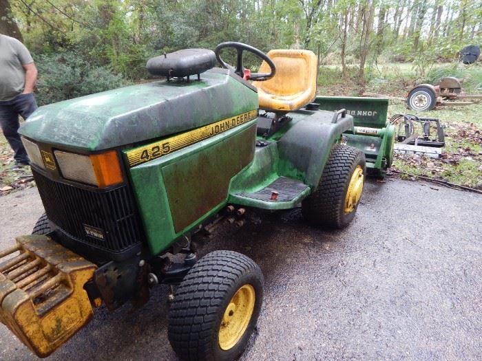 JOHN DEERE tractor with lots of potential! Several accessories and really a bargain considering all that comes with it.