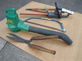 There are lots of lawn & garden tools in working order.