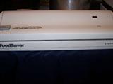 Food saver vacuum packing unit with box and instructions.