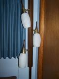 Very retro floor to ceiling lamp, hip piece of merchandise.