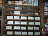 A collection of hundreds of nuts, bolts, screws, and many other hardware items labeled in containers.