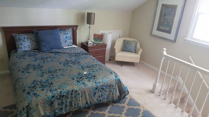 Room view showing QS bed, mattress, boxsprings and MCM off white swivel chair