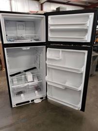 Frigidaire black refrigerator freezer.