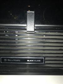 Slide projector and cube and thousands of slides from all over the world including war photos