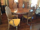 Large dining table incudes 2 leaves and custom table pad. Set of 8 chairs