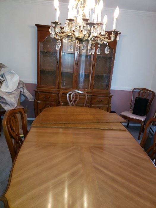 Table has had the table pad on it for 50 years. Pristine Condition-Size 76 x 41 with leaf.  Comes with Six Chairs.