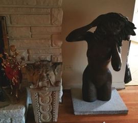 Concrete architectural detail (very heavy) said to come from a Chicago building. Salmones' "Woman in the Wind"