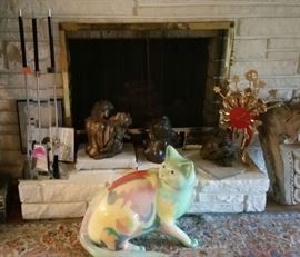 More Salmones sculptures. Awesome floor cat. Pedro Friedeberg 3-legged clock.