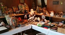 Collection of masks, animal figurines, collection of old hotel keys, interesting ephemera, pandas.