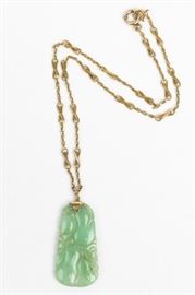 A jadeite, 14k yellow gold necklace