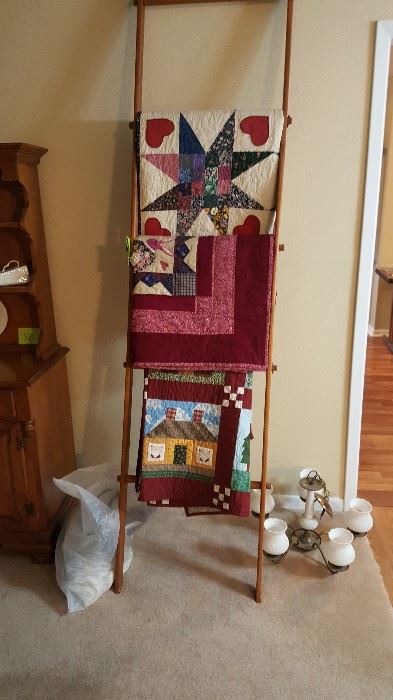 Handmade quilts and quilt rack, milk glass chandelier