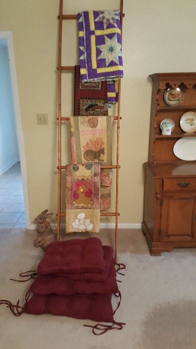 Handmade quilts, quilt rack, cushions