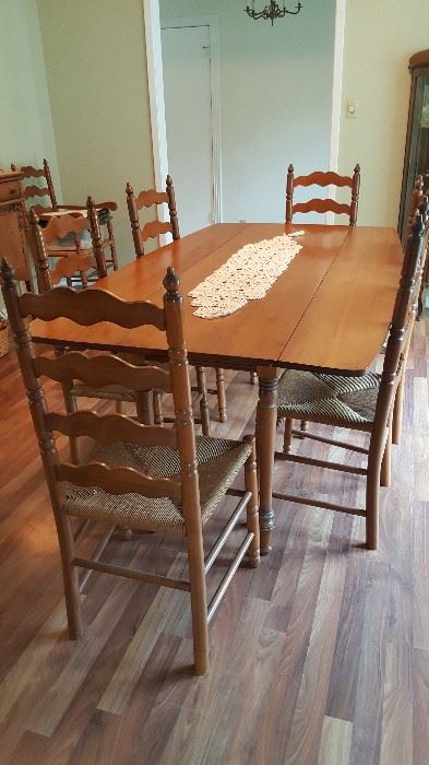 Maple harvest table, seven side chairs, one captain's chair